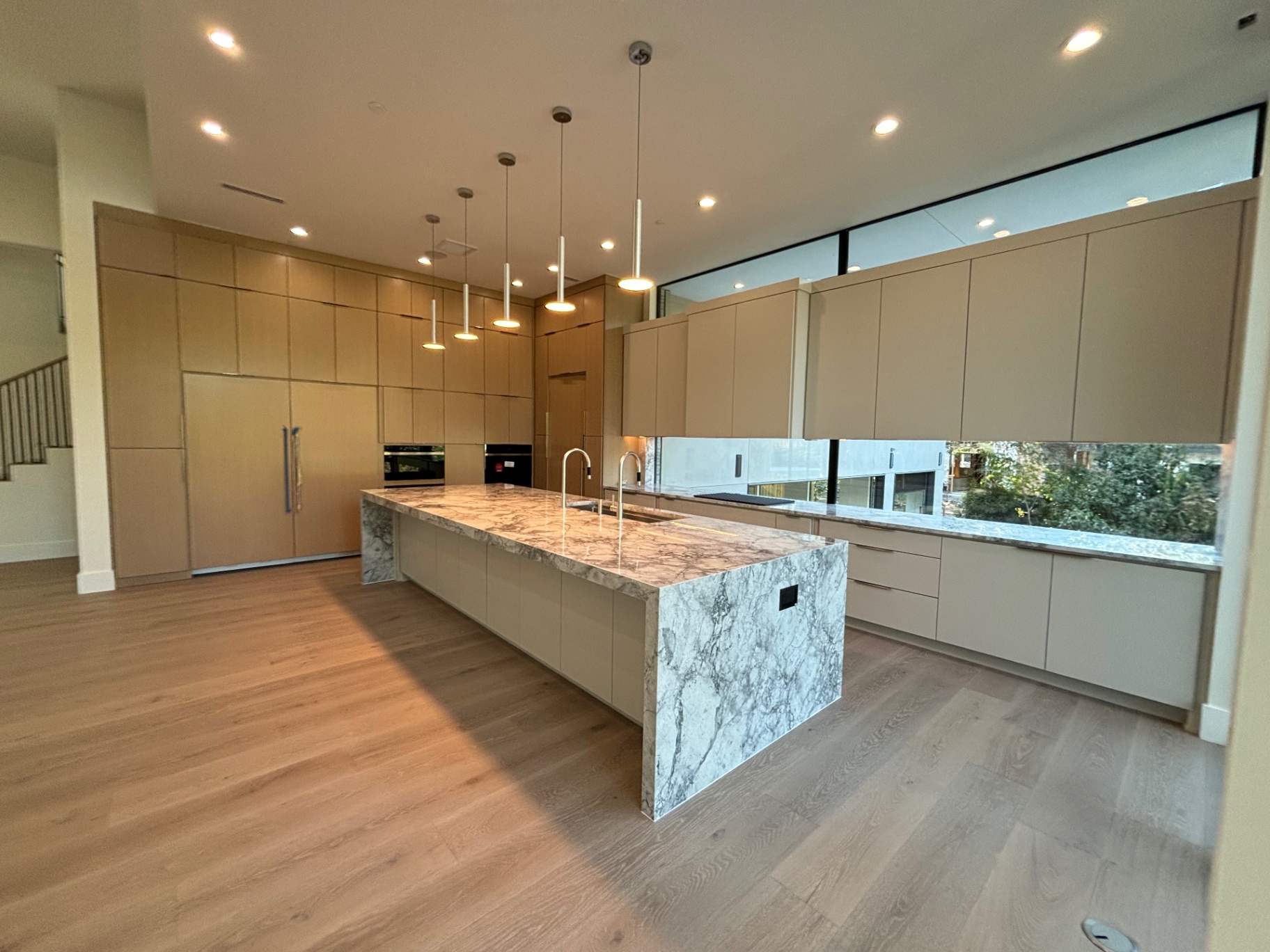 Open kitchen and living area we painted with crisp ceilings and trim